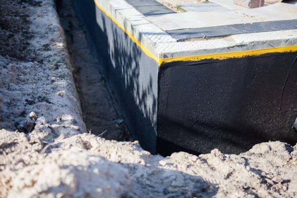 Professional Waterproofing technician working in Fredericksburg, VA